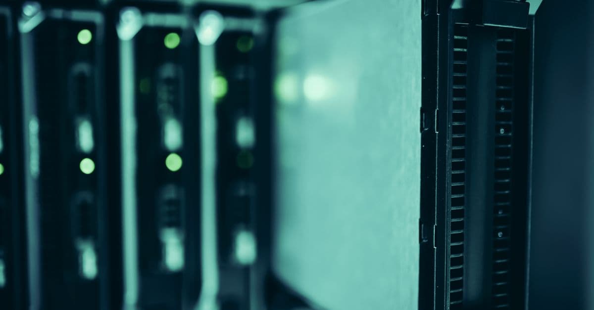 Rows of active server racks in a data center